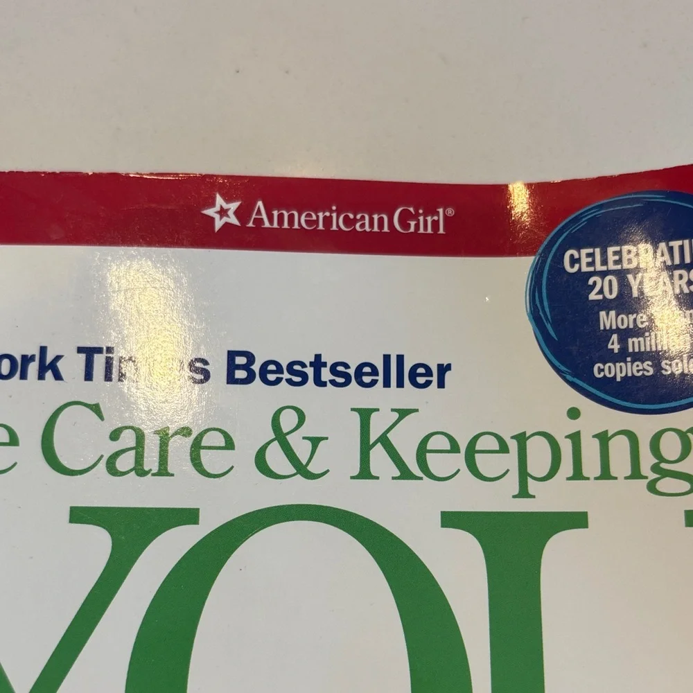 American Girl White Book Cover with Green Title and Red Header